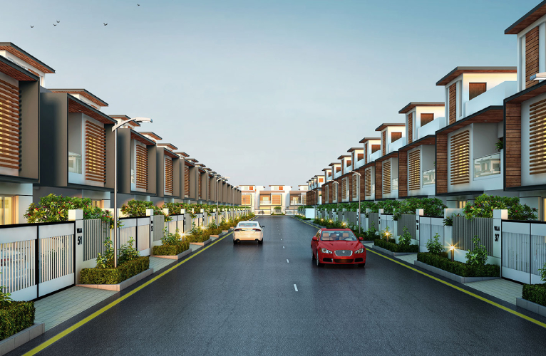 Aerial view of Medavakkam to Mambakkam road where apartments and Premium Villas in Chennai seen along the road in a scenic background